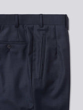 Load image into Gallery viewer, Blue flat-front trousers crafted from Super 130s Italian wool, featuring belt loops, an extension front fastening with a button, and a zip fly. Designed for versatility, they can be finished with either plain bottoms or turn-ups. Additional details include jetted hip pockets, two button-fastening back pockets, grey horn buttons, and a shirt grip inside the waistband for a secure fit.