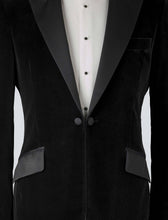 Load image into Gallery viewer, A black velvet dinner jacket designed for black-tie events, featuring a single-breasted one-button closure with a link button, silk peak lapels, and elegant paisley lining. Details include silk-covered buttons, double vents, a handkerchief pocket, and slanted silk pocket flaps that can be tucked in for a jetted look.