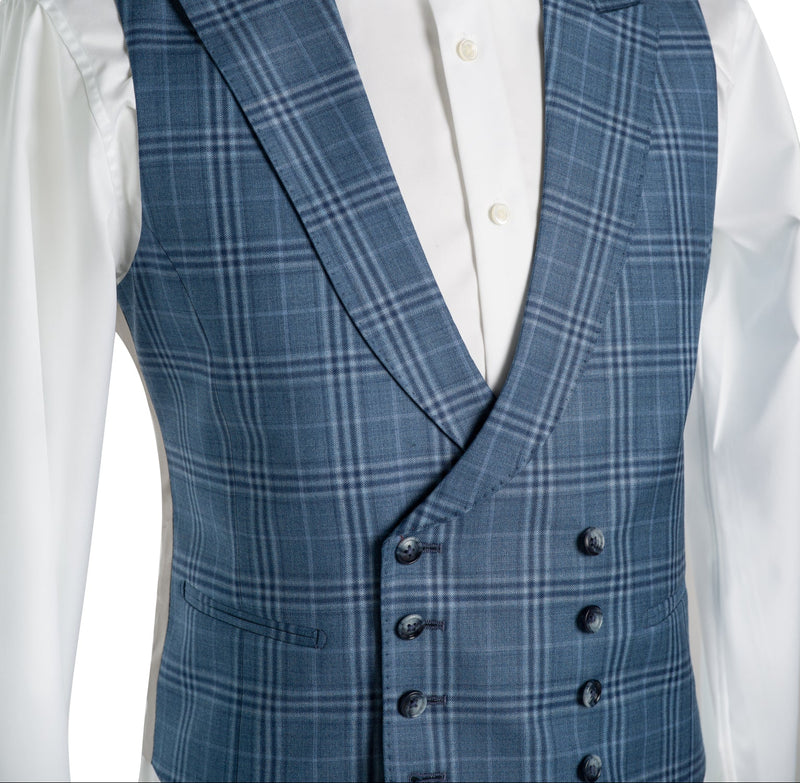 Blue checkered  waistcoat on a mannequin with a white shirt underneath