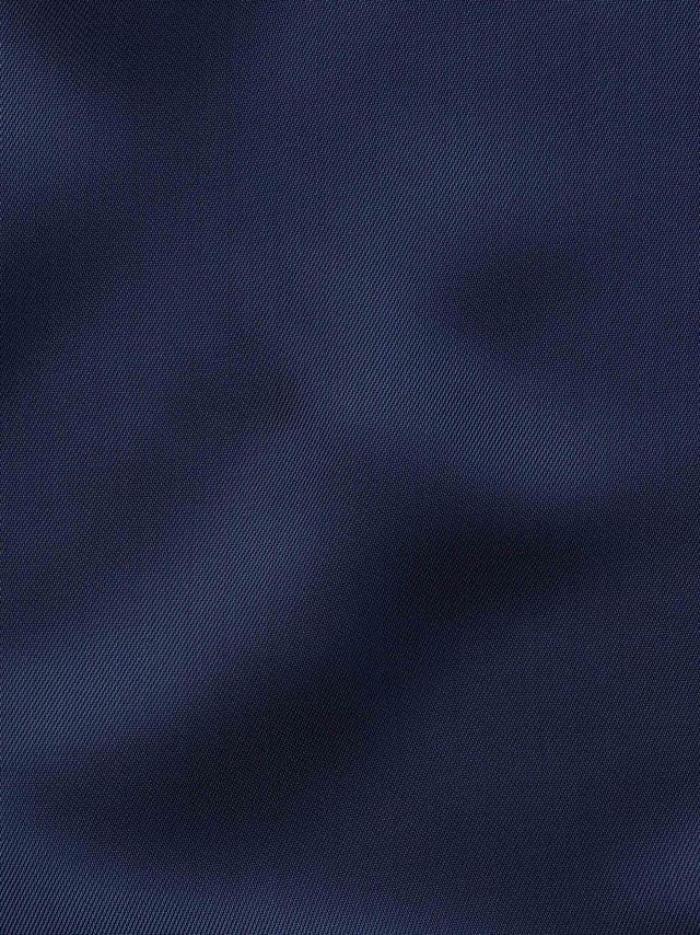 Elegant navy lining inside the jacket and waistcoat, adding a refined touch and subtle contrast to the blue Super 130s Italian wool suit.